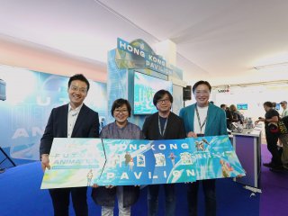 The Cultural and Creative Industries Development Agency under the Culture, Sports and Tourism Bureau led an industry delegation to participate in the Annecy International Animation Film Festival and Market 2026 in France from June 23 to 26 (Annecy time), and sponsored the industry to set up the Hong Kong Pavilion and hold the Hong Kong Partner Pitches at the event. Photo shows Assistant Commissioner for Cultural and Creative Industries Miss Yvonne Ip (second left), Deputy Representative of the Hong Kong Economic and Trade Office in Brussels Mr Kasper Ng (first left), a representative of the Hong Kong Digital Entertainment Association and a guest attending the opening ceremony of the Hong Kong Pavilion.